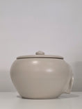 Load image into Gallery viewer, Common Genetics, a wide lidded jar, left side view
