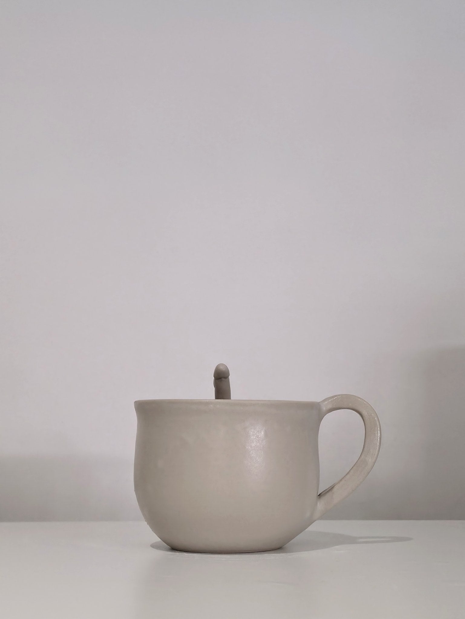 The Penis Cup, handmade ceramic cup, side view