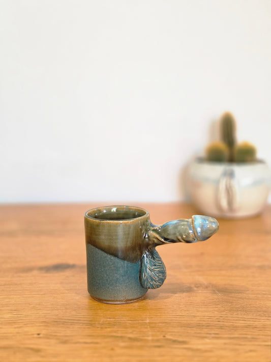 Coffee dick half erect with veins, side, close