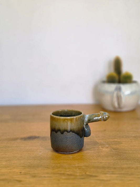 Coffee dick half erect, side, the handle to the right