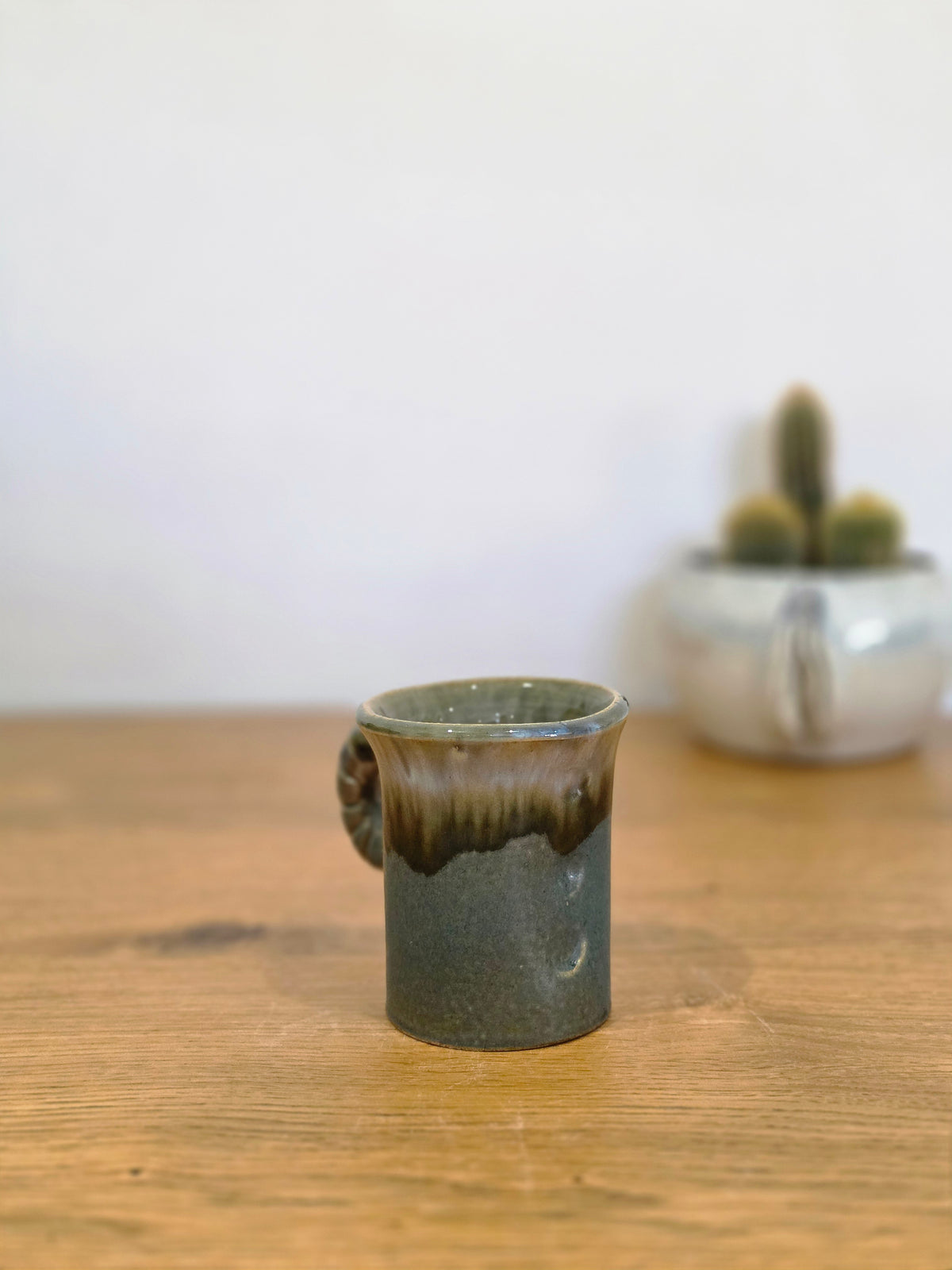 Anal thumb coffee cup, side, from the right