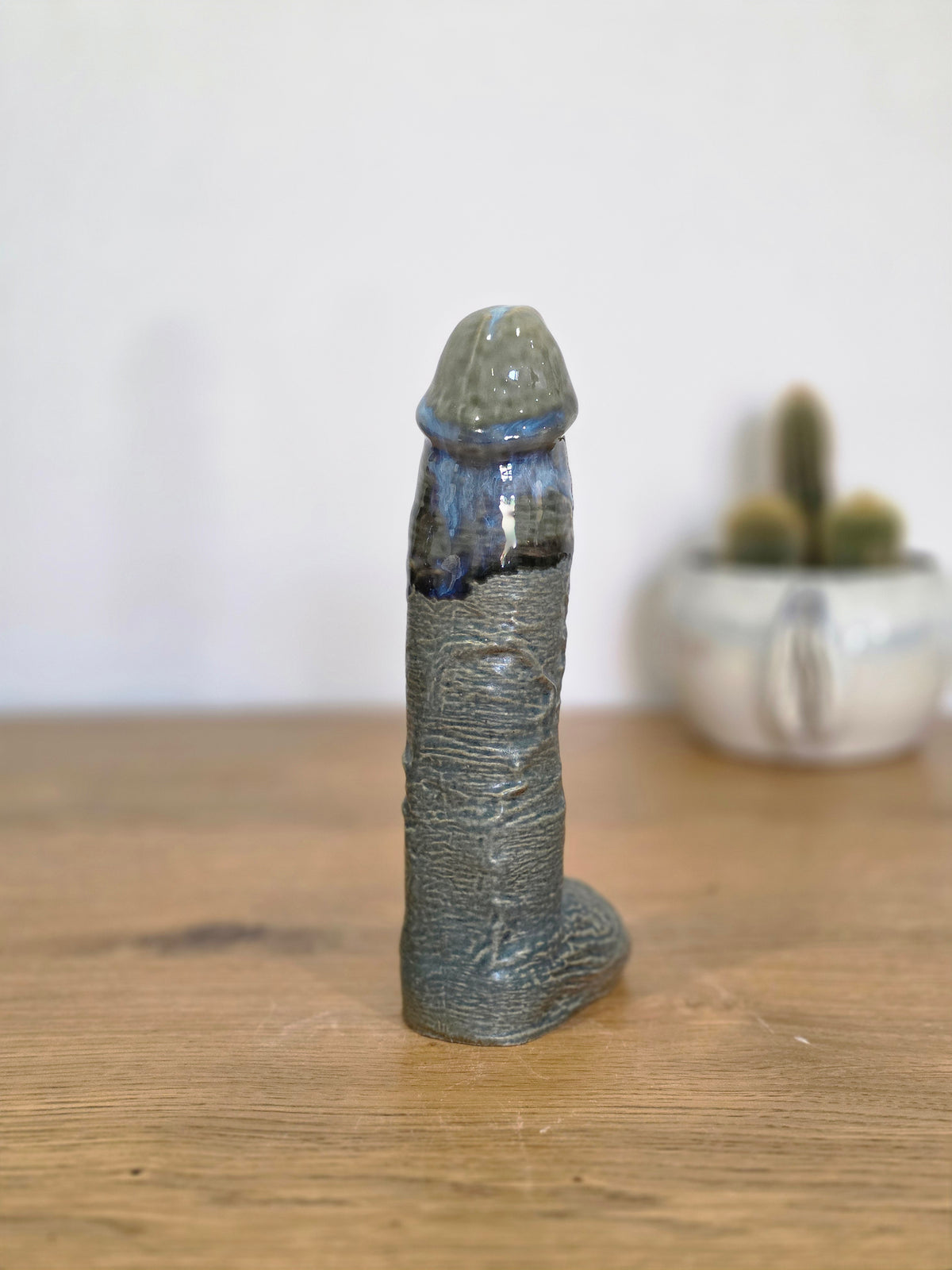 Sculpture, blue and grey over dark grey, front, straight on