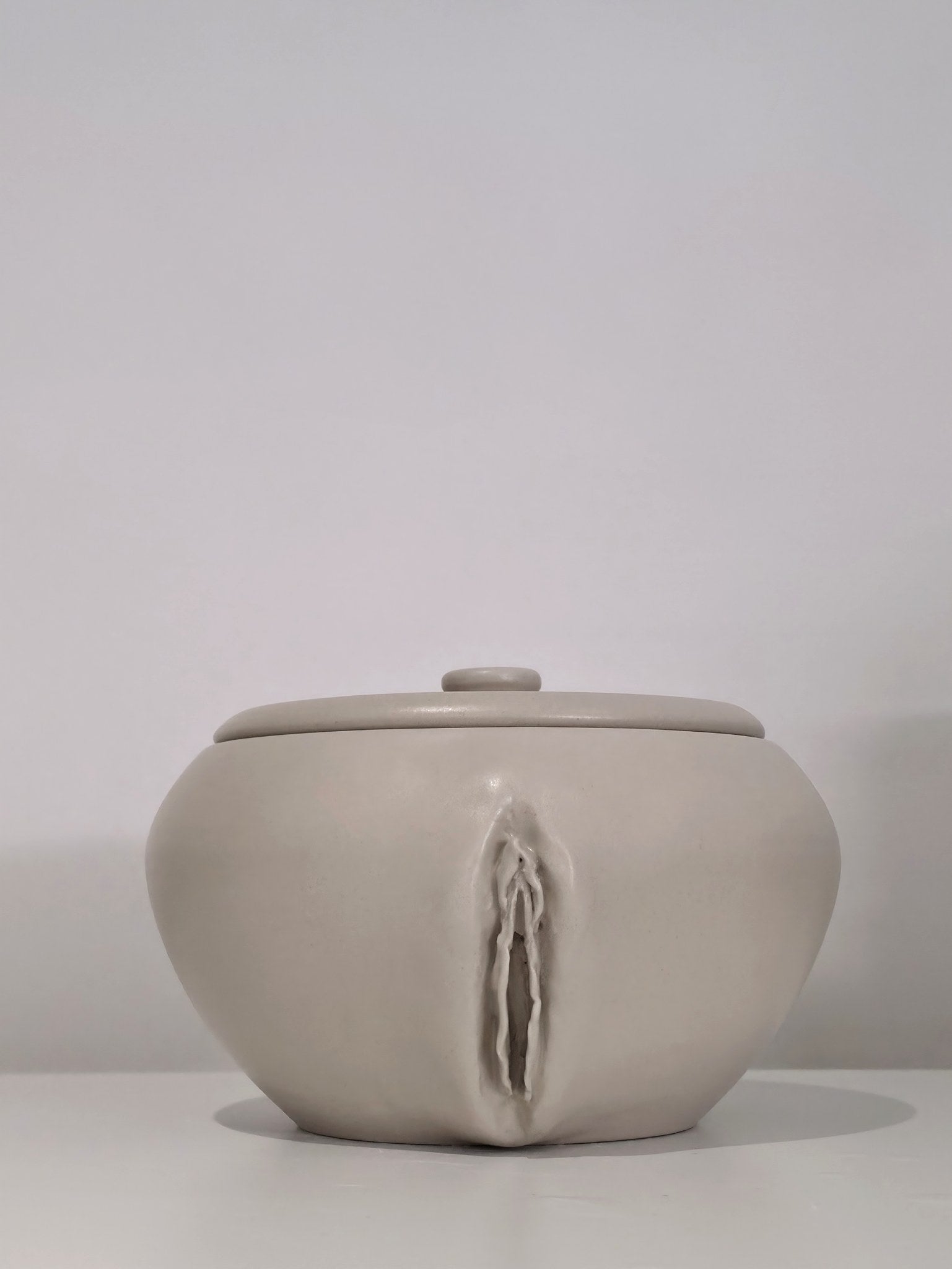 The Vulva Jar, handmade lidded ceramic jar, front view with lid
